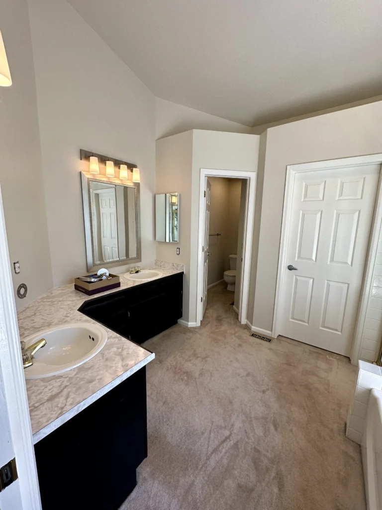 A bathroom with new wall paint and trim