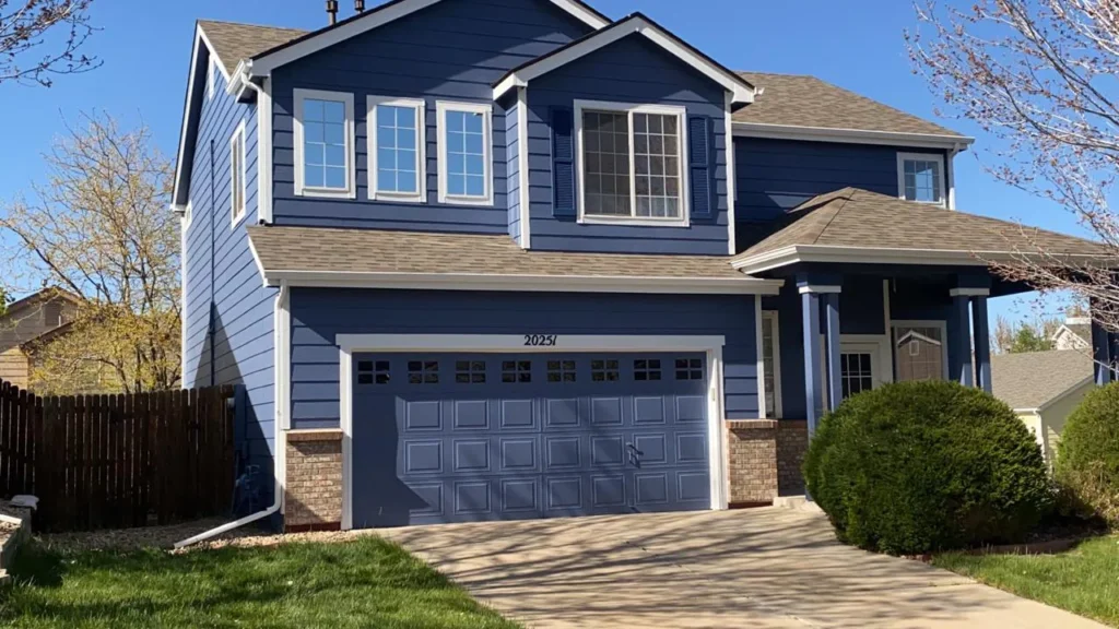 A house with exceptional blue paint and white trim