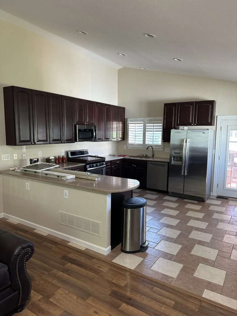 An updated kitchen with new appliances, counters, cabinets and paint